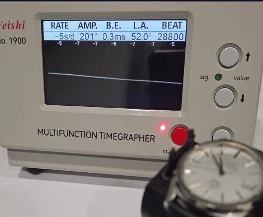Timegrapher reading the movement of a Swiss watch during diagnosis